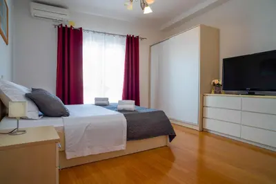 Krevet ili kreveti u jedinici u objektu Ivana - Sea view apartment with garage