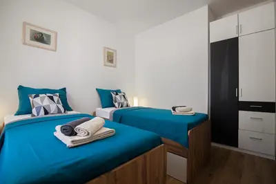 Krevet ili kreveti u jedinici u objektu Family Apartments Brach - Free Parking