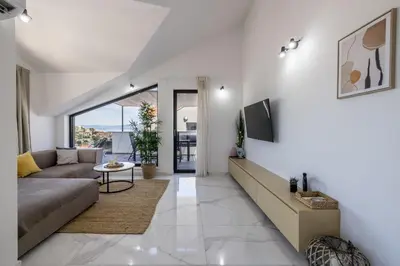 TV i/ili zabavni centar u objektu Modern Sunset Sea View Apartment with Large Terrace - Immortelle