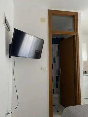 TV i/ili zabavni centar u objektu Apartments Mate
