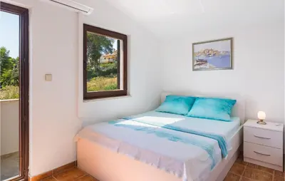 Krevet ili kreveti u jedinici u objektu Awesome Home In Stomorska With House Sea View