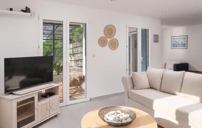 TV i/ili zabavni centar u objektu Villa Sea Escape