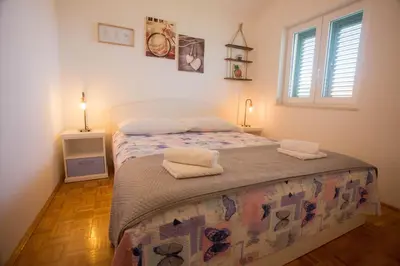 Krevet ili kreveti u jedinici u objektu Apartments Trešnja