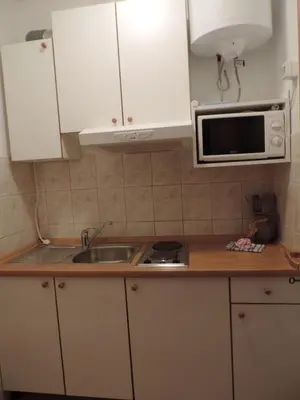 Kuhinja ili čajna kuhinja u objektu Room in Brela with air conditioning, WiFi, washing machine 4947-6