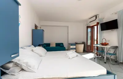 Krevet ili kreveti u jedinici u objektu Apartments Near Beach