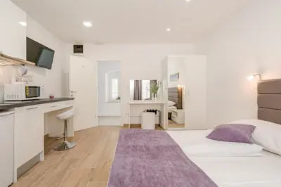 Krevet ili kreveti u jedinici u objektu Apartments Villa Tudor 1