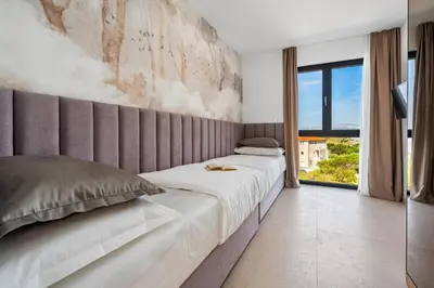 Krevet ili kreveti u jedinici u objektu Stylish Villa Olea with heated pool and panoramic sea views