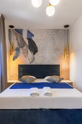 Krevet ili kreveti u jedinici u objektu Villa Capitis in the center- Exclusive Apartment-Stunning Fortress View