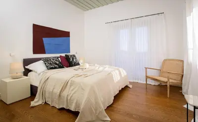 Krevet ili kreveti u jedinici u objektu Elegant Brac Villa 4 Bedrooms Villa Shoreline Serenity Stunning Sea Views