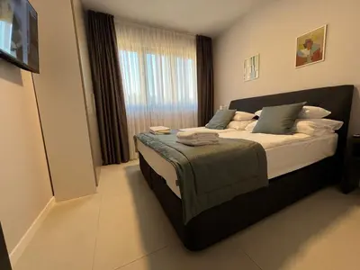 Krevet ili kreveti u jedinici u objektu DINORA Exclusive Apartments