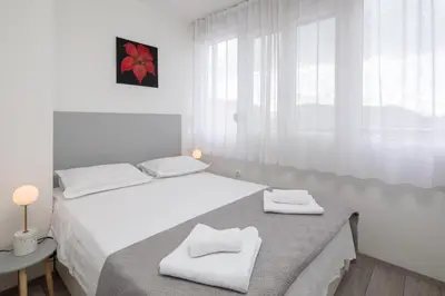 Krevet ili kreveti u jedinici u objektu West Side Apartment