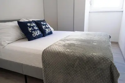 Krevet ili kreveti u jedinici u objektu Beachfront apartment Plaza