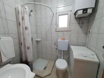 Kupaonica u objektu Slava Apartment