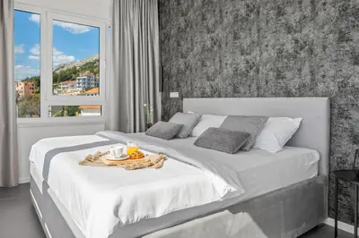 Krevet ili kreveti u jedinici u objektu Villa Grey with 4 bedrooms, Heated pool, Sauna, Media room, Sea Views