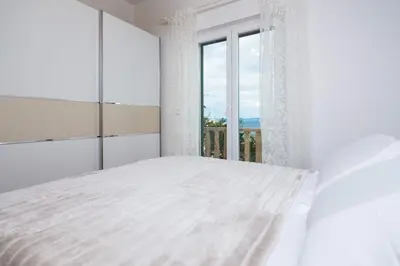 Krevet ili kreveti u jedinici u objektu Apartment Riva Mare with Sea View in the center
