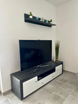 TV i/ili zabavni centar u objektu Apartament Sunny Mimice z widokiem na morze