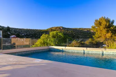 Bazen u objektu VILLA PHILIPPA - luxurious five-room villa - idyllic location - first row to the sea - spectacular view of the sea bay - unforgettable sunsets - 15 minutes from Supetar ferry port - free parking - private heated pool ili u blizini
