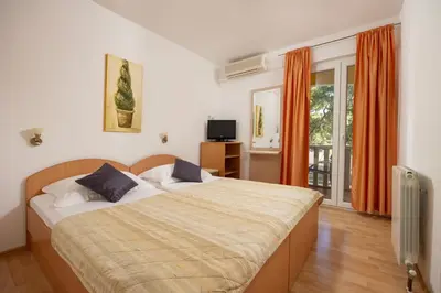 Krevet ili kreveti u jedinici u objektu Just Meters from the sea Lavica Beachfront Apartments