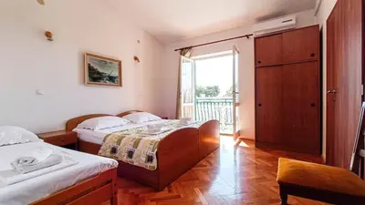 Krevet ili kreveti u jedinici u objektu Apartments by the sea Promajna, Makarska - 23184