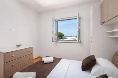 Krevet ili kreveti u jedinici u objektu Apartments Teo - Center with Free Parking