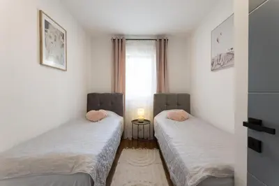 Krevet ili kreveti u jedinici u objektu Holiday Lux