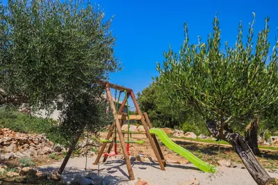 Dječje igralište u objektu Villa Luisa für bis zu 8 Personen mit Pool, Klima, Grill, Tischtennis, Boccia