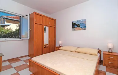 Krevet ili kreveti u jedinici u objektu Holiday Home Supetar 98 With Game Room