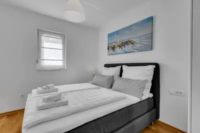 Krevet ili kreveti u jedinici u objektu Luxury and modern apartment with sea view and garage