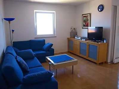 TV i/ili zabavni centar u objektu Molo Lozna Apartments