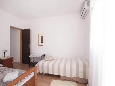 Krevet ili kreveti u jedinici u objektu Apartments Mira -One Bedroom Apartment with Terrace and Sea View A1