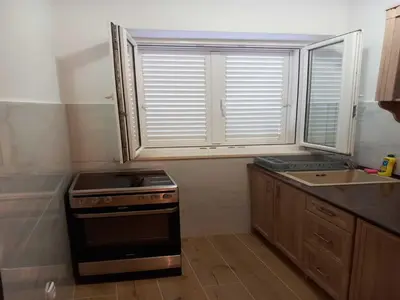 Kuhinja ili čajna kuhinja u objektu Apartments Kalajzic - Two Bedroom Apartment with Garden and Terrace A2 ST