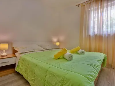 Krevet ili kreveti u jedinici u objektu Apartments Lenka - Two Bedroom Apartment with Garden Terrace A4