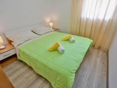 Krevet ili kreveti u jedinici u objektu Apartments Lenka - Two Bedroom Apartment with Garden Terrace A4