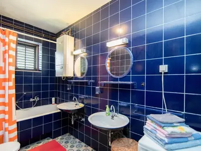 Kupaonica u objektu Apartments Mare- Comfort Two Bedroom Apartment with Terrace A1 ST
