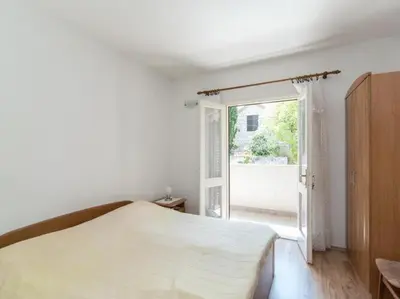 Krevet ili kreveti u jedinici u objektu Apartment Alana - Two Bedroom Apartment with Terrace and Sea View - ST