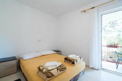 Krevet ili kreveti u jedinici u objektu Apartments Boguvila - Two-Bedroom Basic Apartment with Terrace A1 - ST