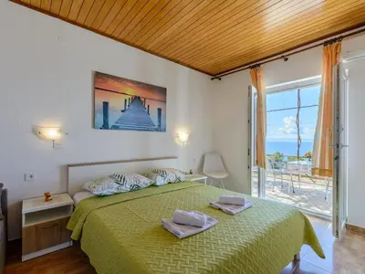 Krevet ili kreveti u jedinici u objektu Rooms Sani- Double Room with Terrace and Sea View S2