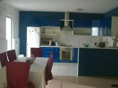 Kuhinja ili čajna kuhinja u objektu Apartment Roksy - Two-Bedroom Apartment with Terrace and Sea View ST