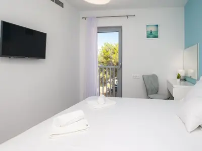 Krevet ili kreveti u jedinici u objektu Apartments Dva Galeba - One Bedroom Apartment with Sea View 206