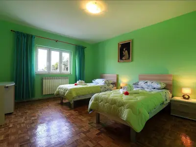 Krevet ili kreveti u jedinici u objektu Apartment Villa IN - Four-Bedroom Apartment with Private Pool