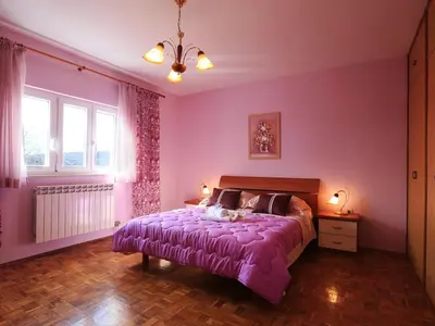 Krevet ili kreveti u jedinici u objektu Apartment Villa IN - Four-Bedroom Apartment with Private Pool