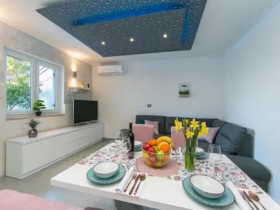 TV i/ili zabavni centar u objektu Apartment Papilio - Two Bedroom Apartment with Terrace
