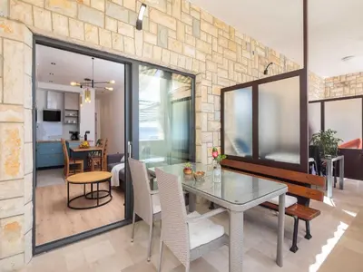 TV i/ili zabavni centar u objektu Apartment Tomas with balcony and sea view