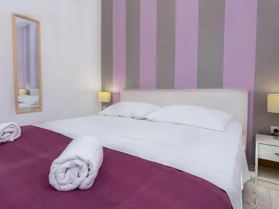 Krevet ili kreveti u jedinici u objektu Apartments Magdales - Two Bedroom Apartment with Balcony A1