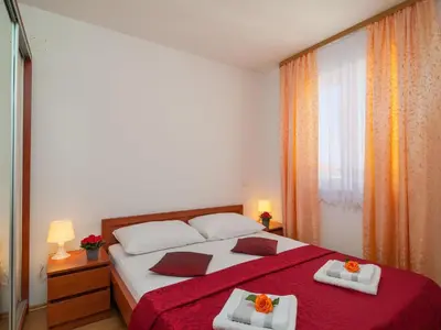 Krevet ili kreveti u jedinici u objektu Apartments Island Beat - Two Bedroom Apartment with Balcony and Sea View A2 ST
