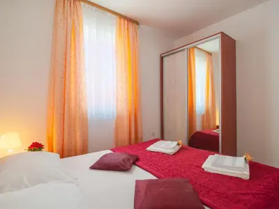 Krevet ili kreveti u jedinici u objektu Apartments Island Beat - Two Bedroom Apartment with Balcony and Sea View A2 ST