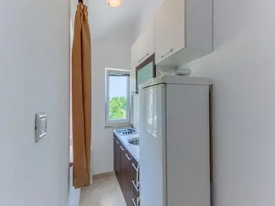 Kuhinja ili čajna kuhinja u objektu Apartments Ivo - One bedroom apartment with terrace and sea view A5