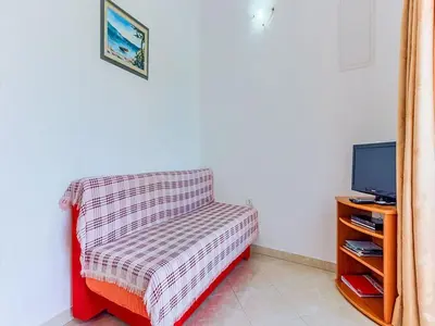 TV i/ili zabavni centar u objektu Apartments Ivo - One bedroom apartment with terrace and sea view A5