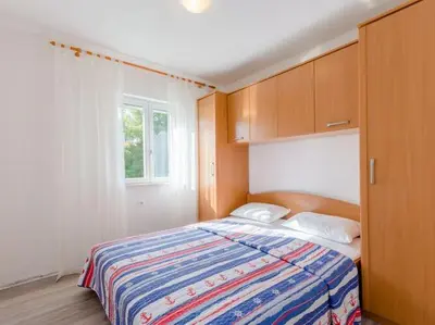 Krevet ili kreveti u jedinici u objektu Villa Stella - Two Bedroom Apartment with Balcony and Sea View Carla