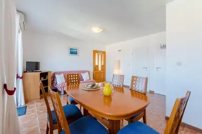 TV i/ili zabavni centar u objektu Villa Stella - Two Bedroom Apartment with Balcony and Sea View Carla